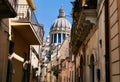 Narrow scenic street in Baroque town Ragusa with traditional townhouses, UNESCO World Heritage Site. Sicily, Italy.