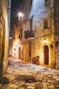 Narrow scenic street at night in city of Monopoli, province Bari, Sauthern Italy