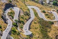 Narrow serpentines on a steep slope with many cars Royalty Free Stock Photo