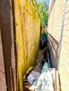 A Narrow Side Of House Area Used For Storage Or Small Access Royalty Free Stock Photo