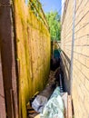 A Narrow Side Of House Area Used For Storage Or Small Access Royalty Free Stock Photo