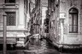 Narrow side street with a boat at Grand Canal, Venice