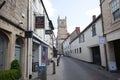 A narrow side street leading to the centre of town in Cirencester, Gloucestershire, UK Royalty Free Stock Photo