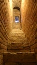 narrow steep staircase inside a medieval tower Royalty Free Stock Photo