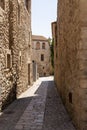 stone street in the medieval town of pals on the costa brava on a sunny summer day Royalty Free Stock Photo