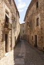 Street in the medieval town of pals on the costa brava on a sunny summer day Royalty Free Stock Photo