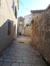 Charming narrow street in old city centre of Rab Croatia with lantern