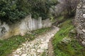 Narrow stone street and walls in Milies village on Pelion mountain. Greece.