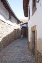 Narrow, stoned street in a spanish village Royalty Free Stock Photo