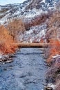 Narrow stream in Provo Canyon with snowy mountain scenery on a cloudy day Royalty Free Stock Photo