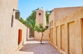 The small adobe minaret of historic Al Mulla mosque, Al Shindagha neighborhood, Dubai, UAE Royalty Free Stock Photo