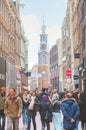 Narrow street of Amsterdam crowded with tourists Royalty Free Stock Photo