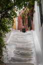 Narrow street in ancient residential district of Anafiotika in Athens Greece