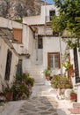 Narrow street in ancient residential district of Anafiotika in Athens Greece