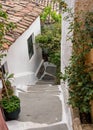 Narrow street in ancient residential district of Anafiotika in Athens Greece