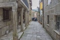 Narrow street with arcades and columns and stone floor in Combarro, a parish belonging to the municipality of Poio in Pontevedra