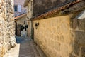 The narrow street of the authentic old town of Perast, Montenegro. Royalty Free Stock Photo