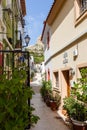 Narrow street in Barrio Santa Cruz in Alicante, Costa Blanca, Spain