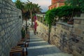 Narrow street and street cafe at morning, Hvar, Dalmatia, Croatia Royalty Free Stock Photo