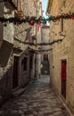 Narrow street with Christmas decorations in Old Town, Kotor Royalty Free Stock Photo