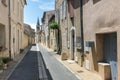 Narrow street in city center of Saint-Saturnin-les-Apt, a small Royalty Free Stock Photo