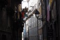 Narrow street of the city of Porto with the Portugal flag Royalty Free Stock Photo