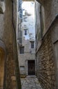 A narrow street with cobblestone road of charming old town Saint Paul de Vence, France Royalty Free Stock Photo