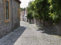 Narrow street with coble stone pavement Royalty Free Stock Photo