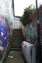 Narrow street with colorful graffiti's in Eastville neighborhood in Bristol city Royalty Free Stock Photo