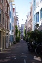 Narrow street in Netherlands , Amsterdam on a summer day Royalty Free Stock Photo