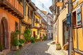 Narrow street in Eguisheim, Alsace, France Royalty Free Stock Photo