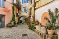 Narrow street with flowers in the old town in France Royalty Free Stock Photo