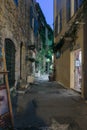 Narrow street with flowers in the old town Mougins in France. Ni Royalty Free Stock Photo