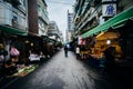 Narrow street with food vendors near Dongmen, Taipei, Taiwan.