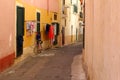 Bike laundry drying shutters corridor colorful, Puglia, Italy