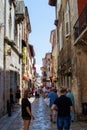 Narrow street full of tourists with colorful croatian houses in the old town of Porec Parenzo, Croatia Royalty Free Stock Photo