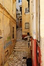 Narrow street in Greek town. Royalty Free Stock Photo