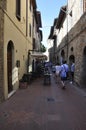 Narrow Street with Historic Architecture Buildings from Medieval San Gimignano hilltop town. Tuscany region. Italy