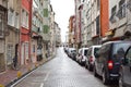 Narrow street of istanbul. houses and cars in istanbul. city in turkey