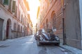 Narrow street in italy with parked retro car Royalty Free Stock Photo