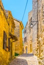 Narrow street in Lacoste village in France Royalty Free Stock Photo