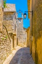 Narrow street in Lacoste village in France Royalty Free Stock Photo