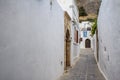 Narrow street in Lindos, Rhodes Island, Greece Royalty Free Stock Photo