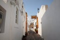 Narrow street in Lindos town on Rhodes island, Dodecanese, Greece. Beautiful scenic old ancient white houses . Famous tourist Royalty Free Stock Photo