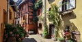 Narrow street lined with timber houses in Eguisheim, Alsace, France Royalty Free Stock Photo