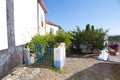 Narrow street in the medieval Portuguese City of Obidos Royalty Free Stock Photo