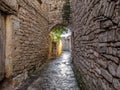 Narrow street in the medieval walled village of Montfalco Murallat in Spain. Walkway Royalty Free Stock Photo