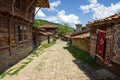 Narrow street in the mountainous Balkan village Royalty Free Stock Photo