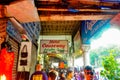 Narrow street in Mumbai filled with crowd.