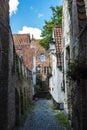 Narrow street with old houses in Bruges, Belgium Royalty Free Stock Photo